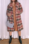 Woman Contrasting Plaid With Elegant Coats